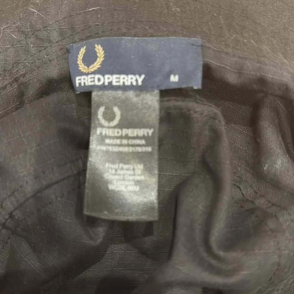 Fred Perry Camo Bucket Hat in Olive Green and Brown